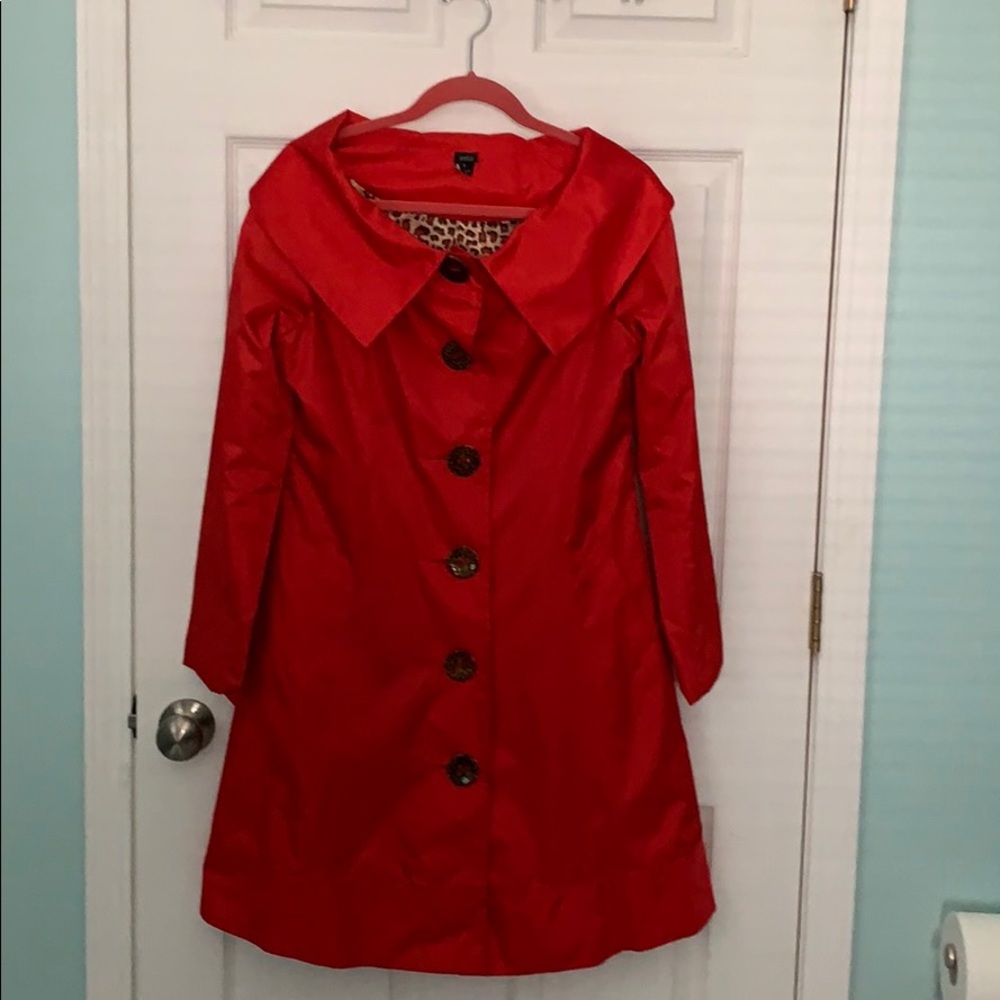 Aziz Red trenchcoat.